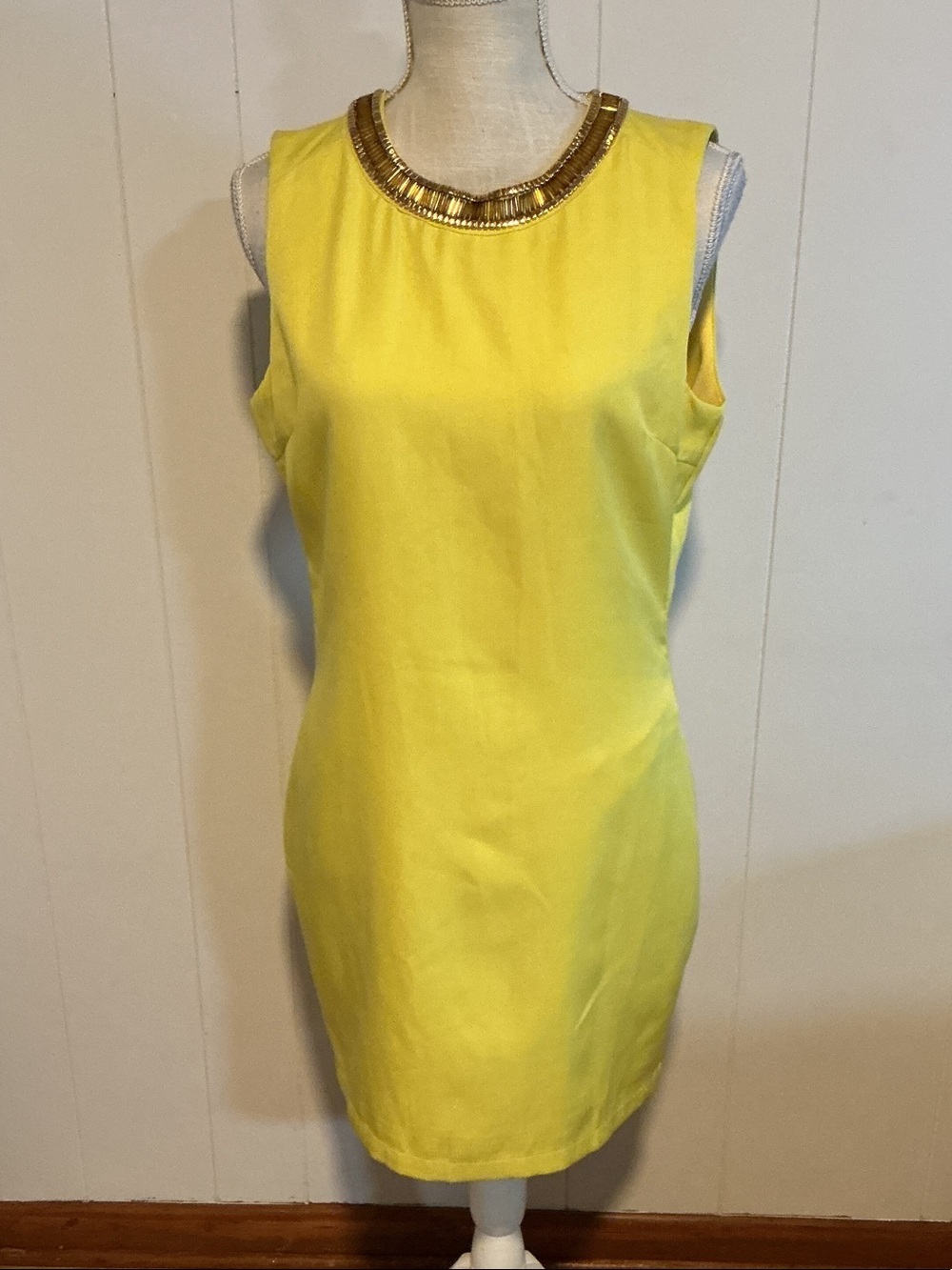 the clothing company Sleeveless Yellow Shift Dress with Gold Beaded Neckline